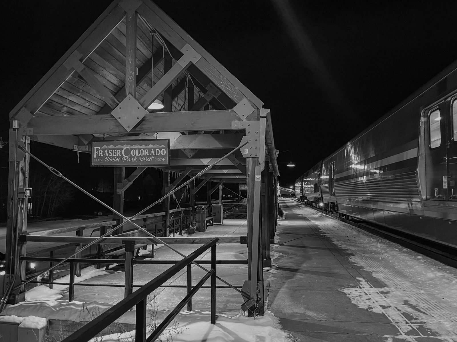Eastbound California Zephyr stopped at the Fraser Colorado Winter Park Resort station after dark.