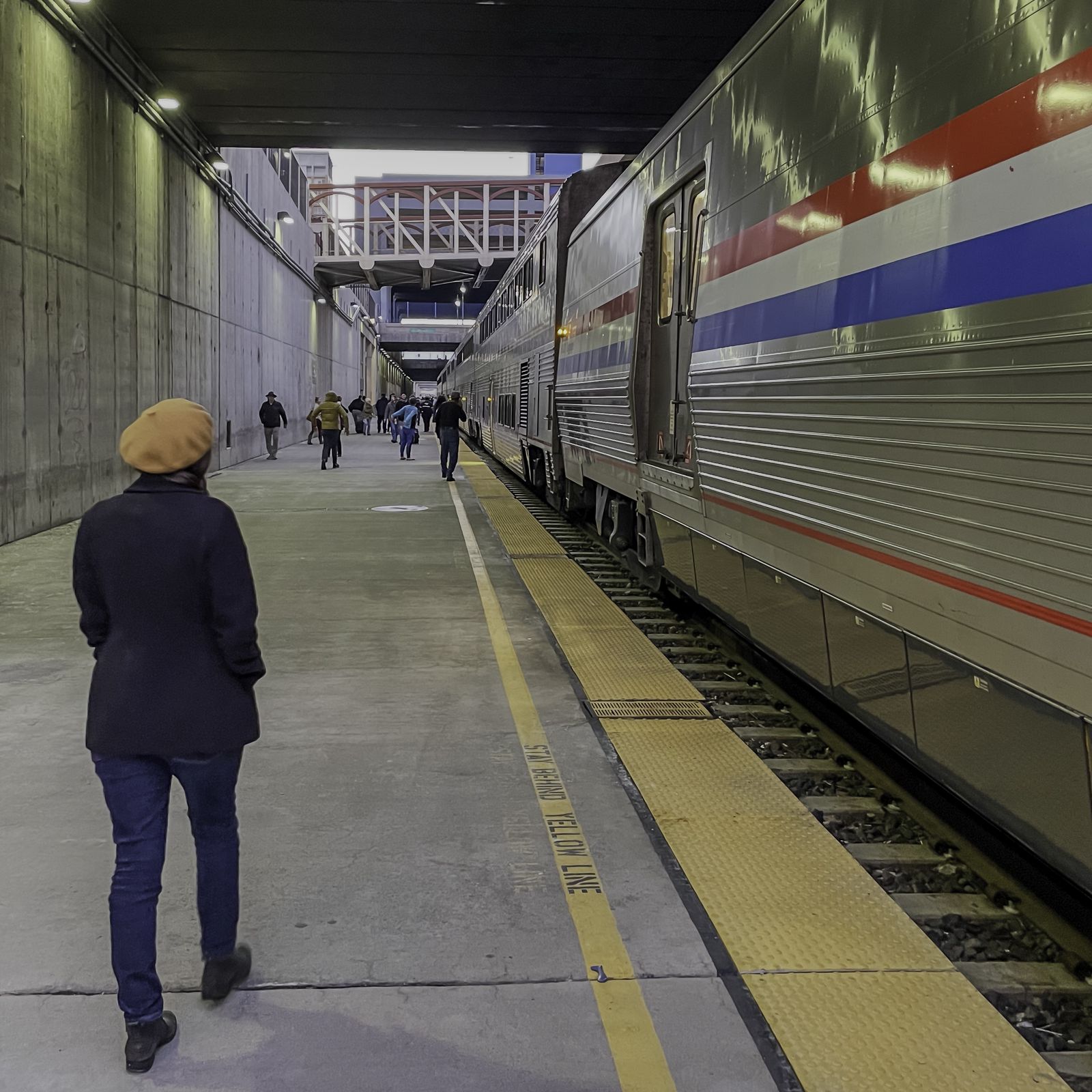 Danielle walks along the platform in the Reno train trench.